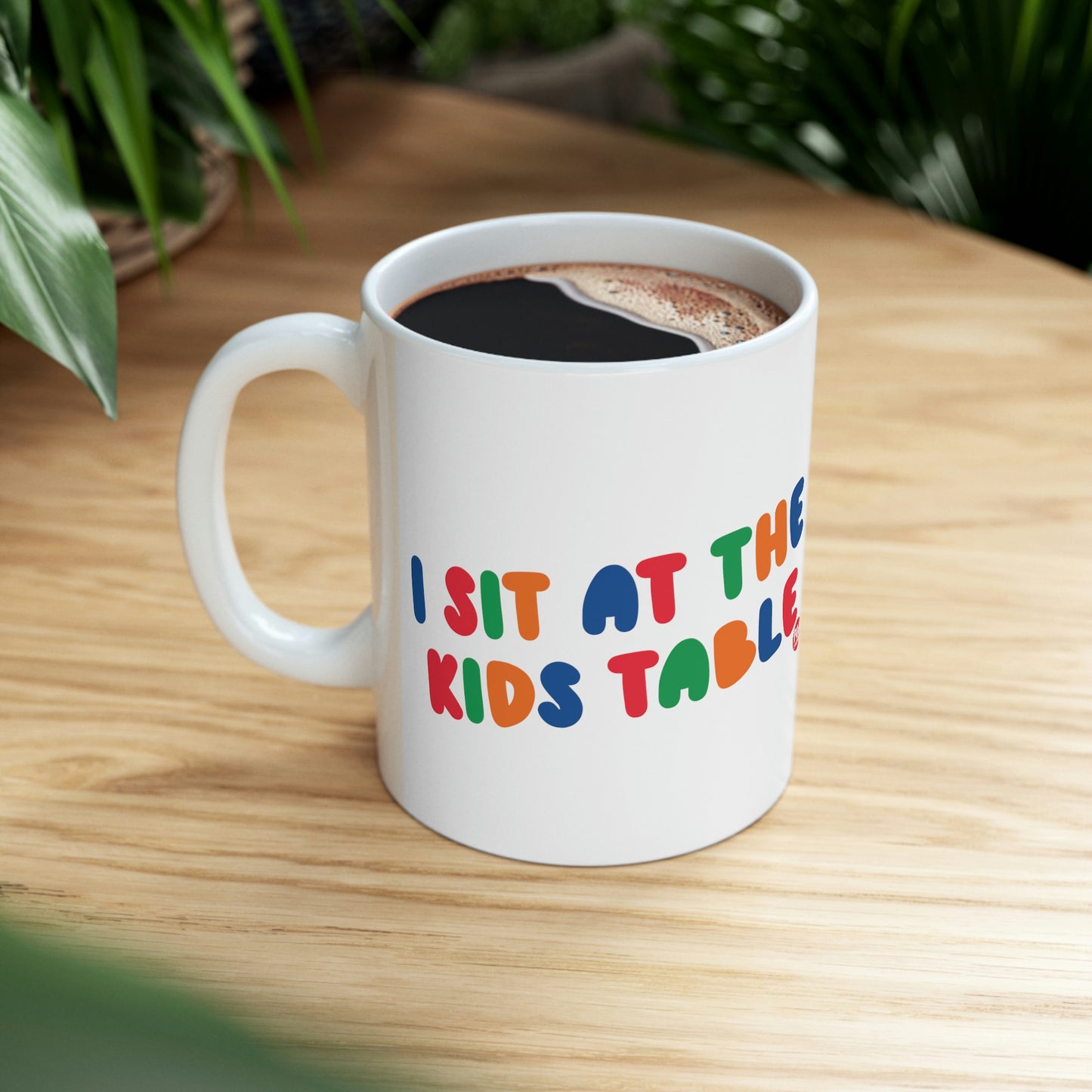 I SIT AT THE KIDS TABLE COFFEE MUG