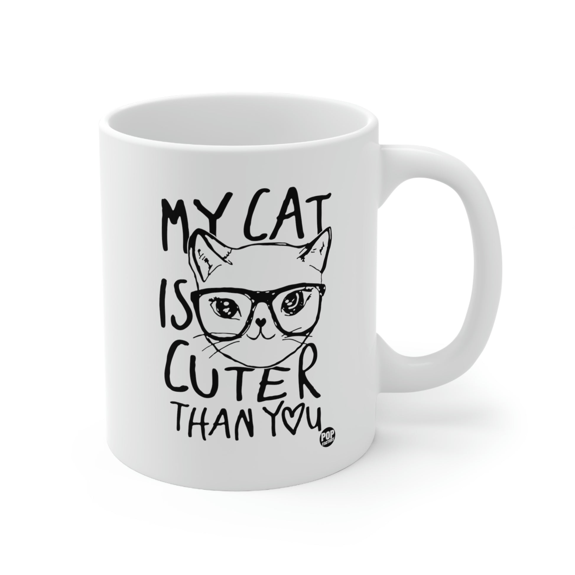 White ceramic mug with cat face illustration and “My Cat Is Cuter Than You” text – Pop Factory® funny cat lover coffee cup
