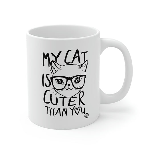 White ceramic mug with cat face illustration and “My Cat Is Cuter Than You” text – Pop Factory® funny cat lover coffee cup
